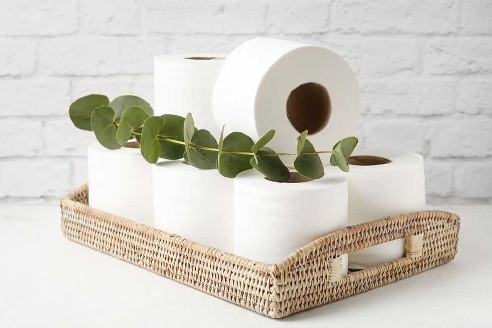 Basket with rolls of toilet paper.