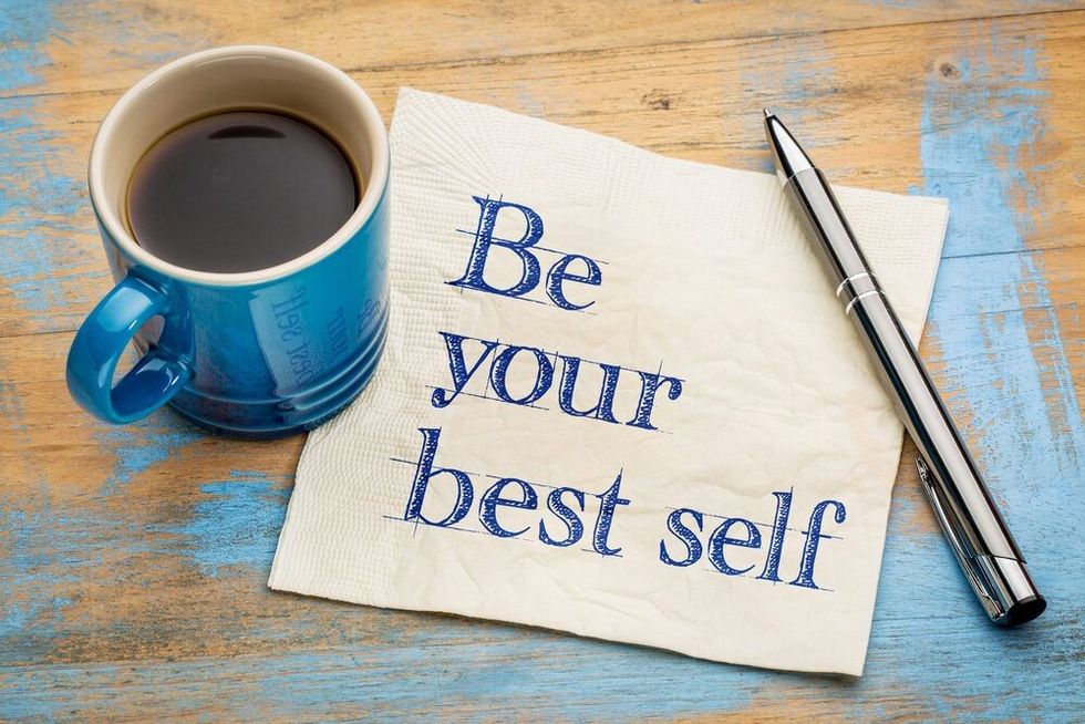 Be your best self - handwriting on a napkin with a cup of espresso coffee