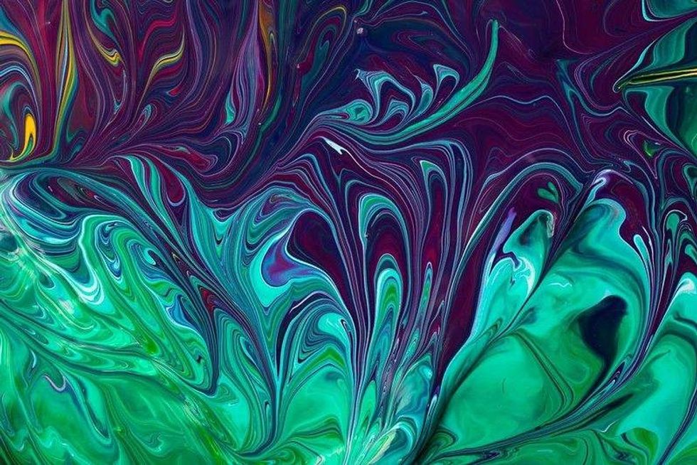 Beautiful liquid texture of the nail polish Green and purple colors