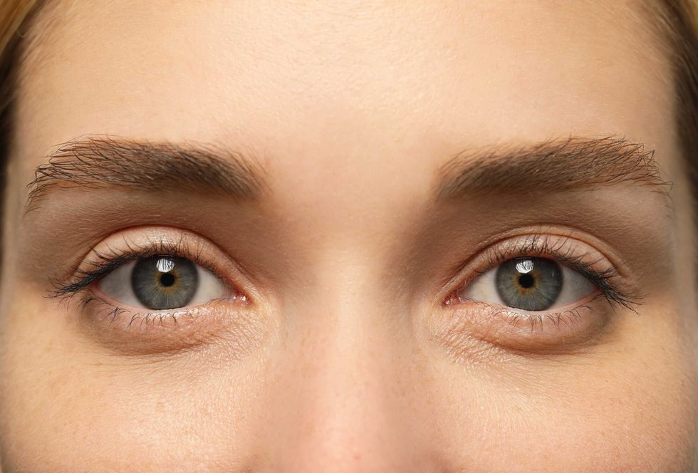 Beautiful woman with grey eyes, closeup view