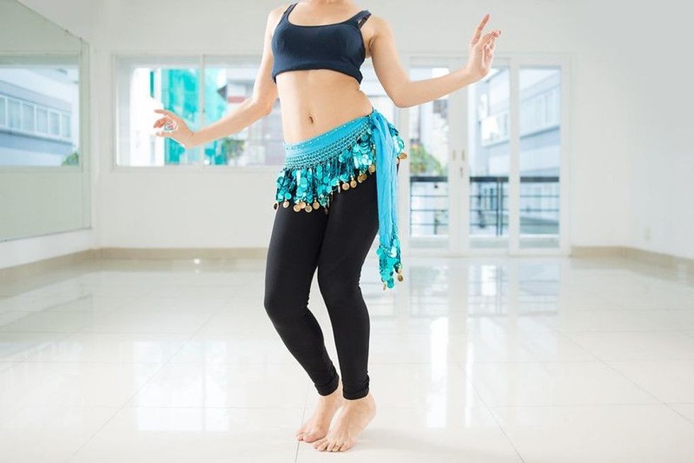 Belly dancer dancing in the class
