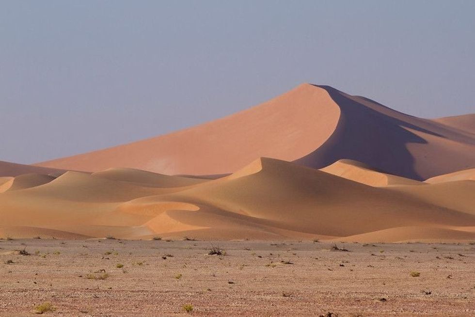 Big dunes of sand and plains in desert