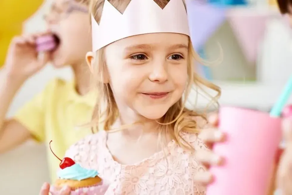 Birthday girl trying her yummy vegan cupcake.