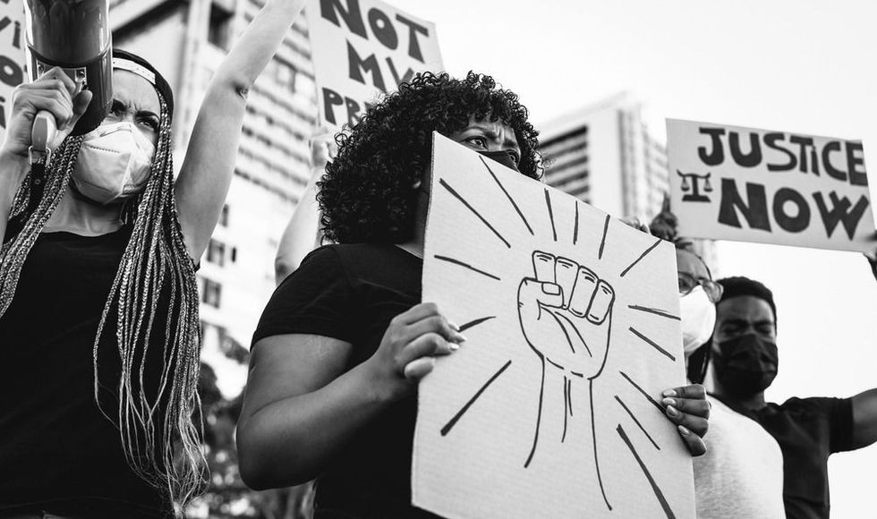 Black lives matter international activist movement protesting against racism and fighting for justice.