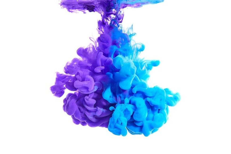 Blue Purple Ink swirling in water.
