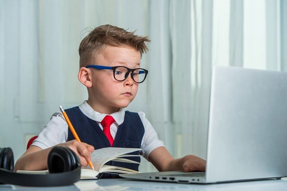 Boy finishing school work