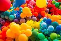 Bright abstract background of jumble of rainbow colored balloons celebrating gay pride