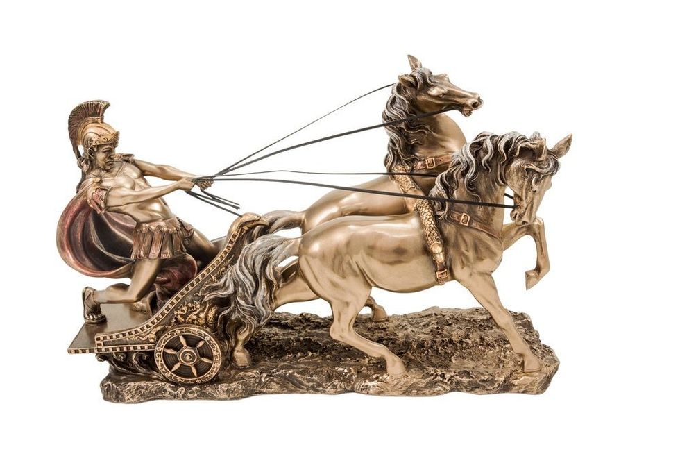 Bronze statuette of the Roman war in a chariot with two horses isolated on a white background