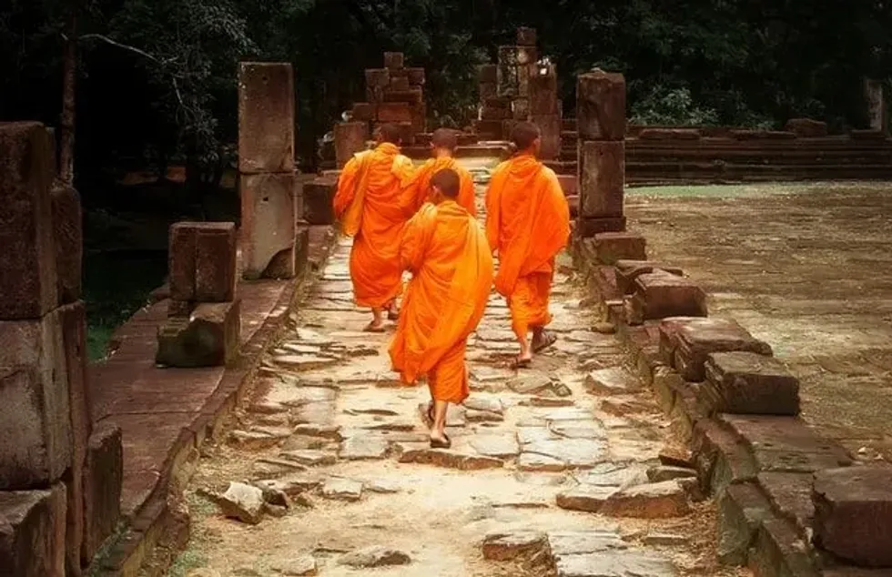 Buddhist monks inside Baphuon temple, Siem Reap - Cambodia