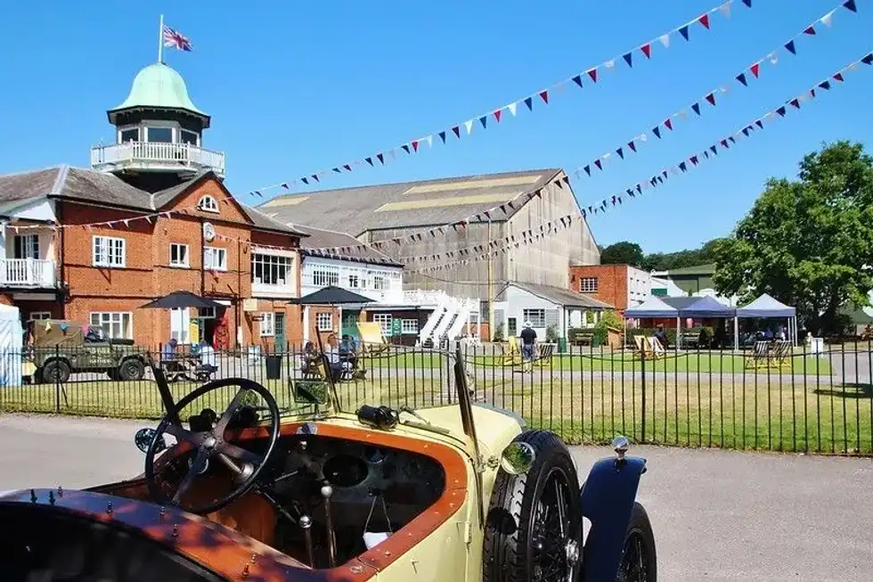 Bunting and old fashioned car at Brooklands Museum.
