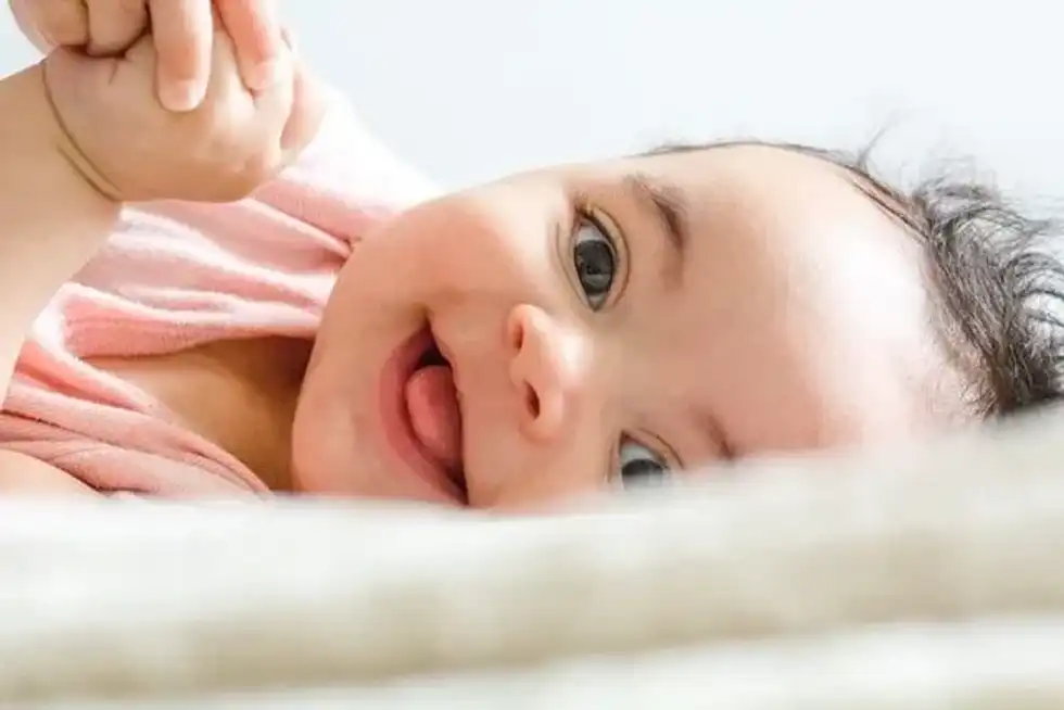 By 11 weeks you can expect to see some smiles.