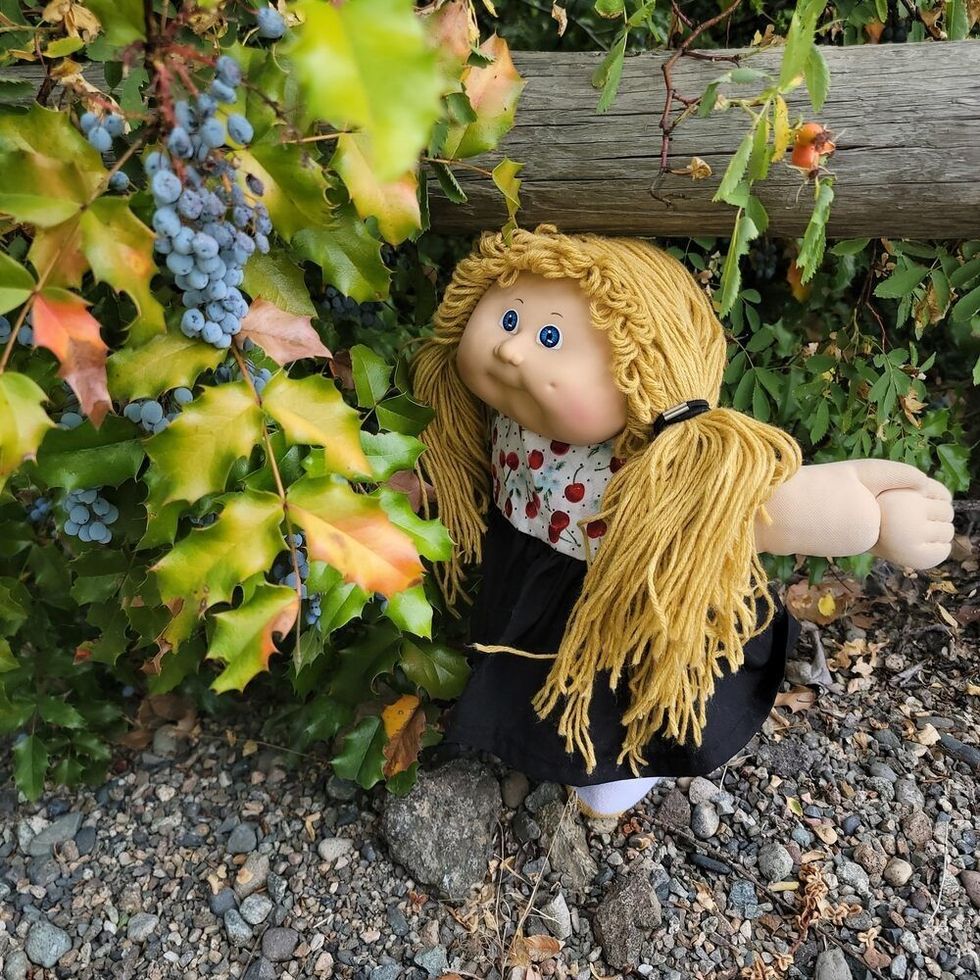 Cabbage patch doll in the garden