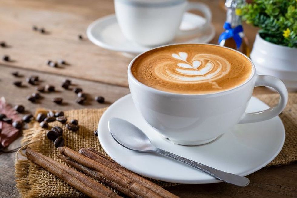 Cappuccino coffee in a glass on the table.
