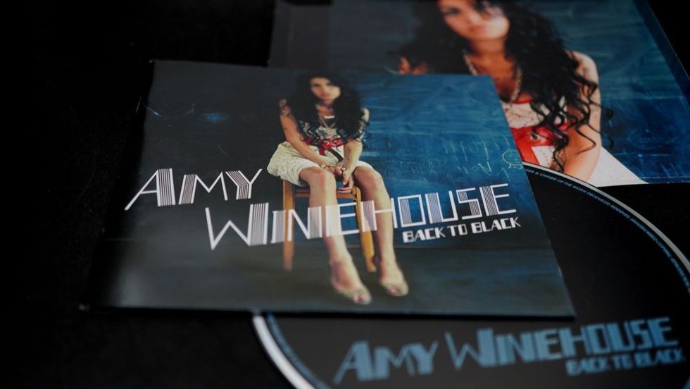 CD covers and inserts by singer-songwriter, stylist, record producer and British guitarist AMY WINEHOUSE.