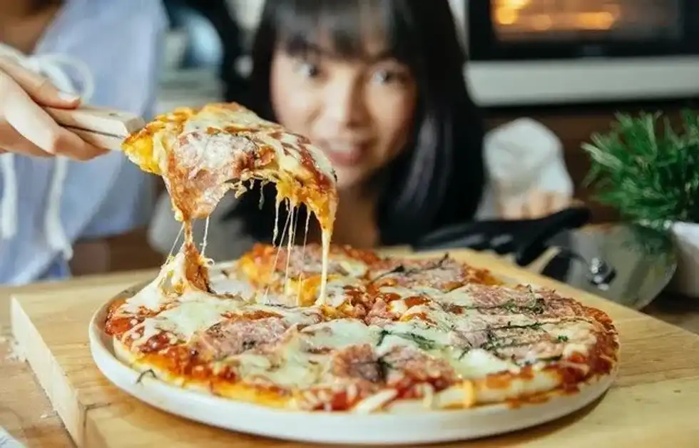 Celebrate National Pizza Day by eating a frozen pizza if you feel lazy.