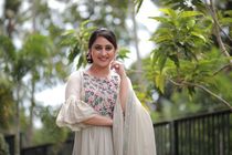 Celebrity actress Miya George posing for photographers in the street before Film conference.