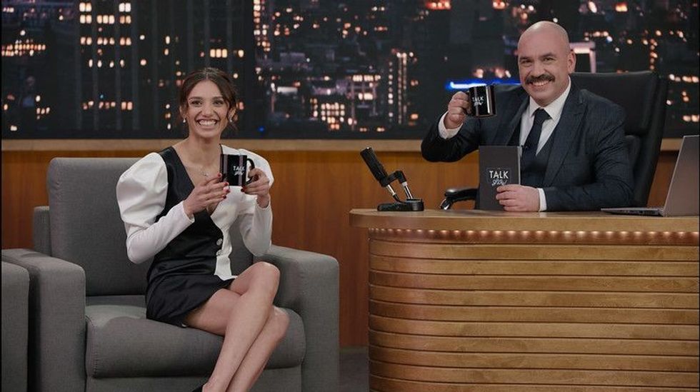 celebrity and a host chatting in a TV show