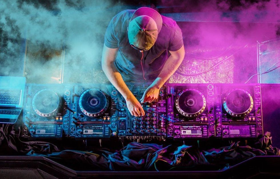 Charismatic disc jockey at the turntable.