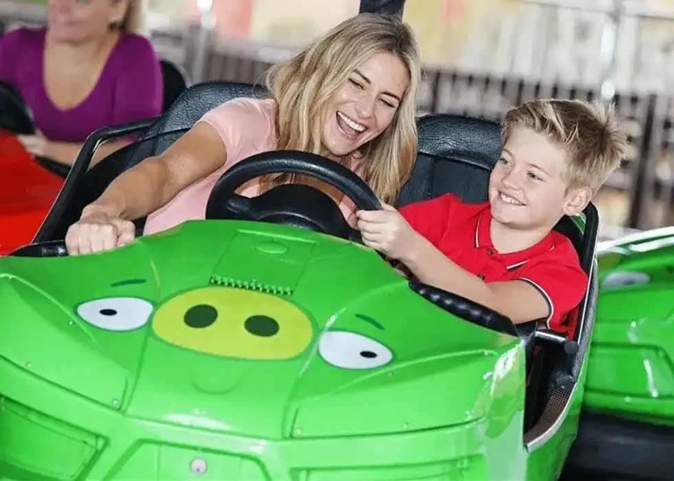 Child and woman on small ride