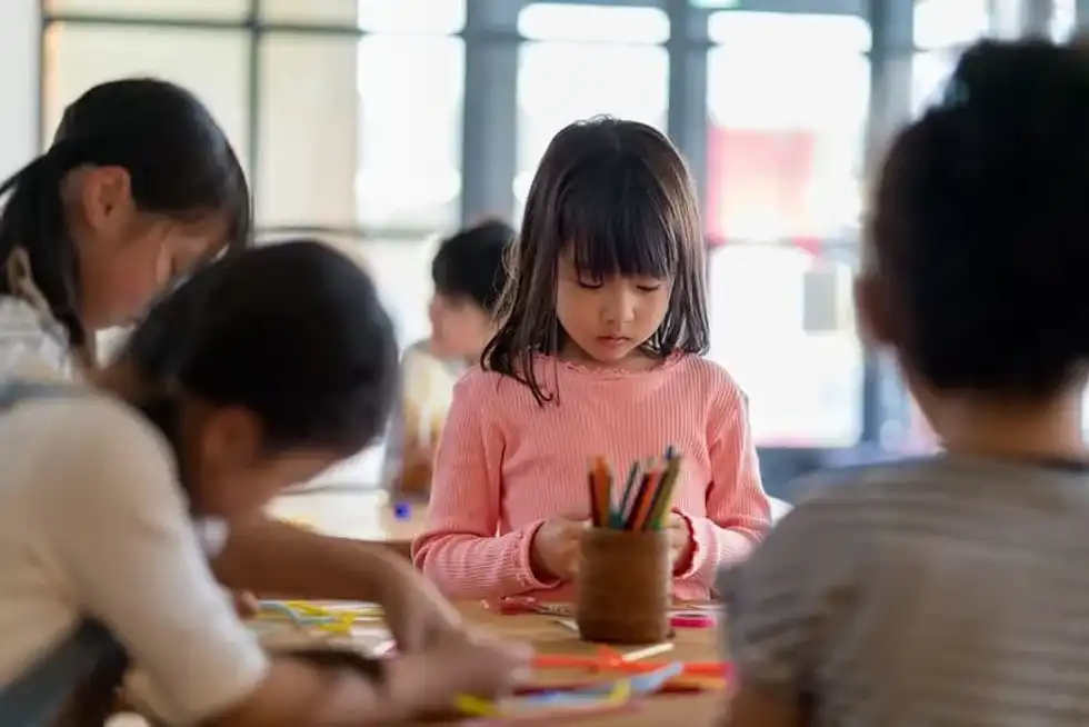child at art class in London