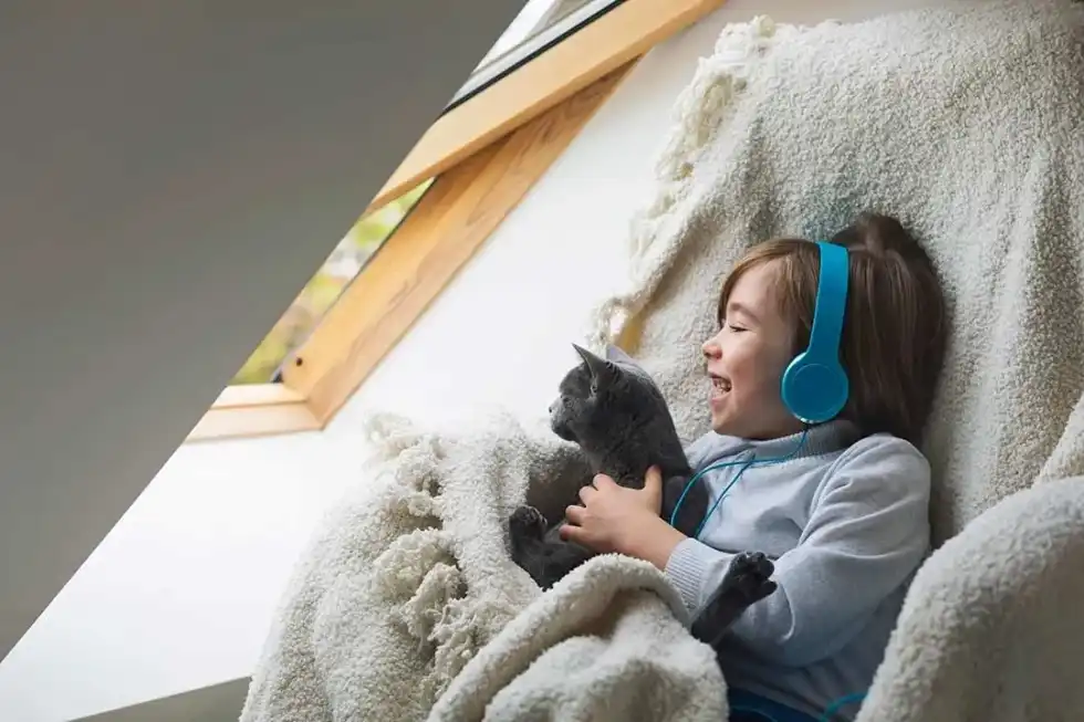 Child listening to a free funny story on Audible.