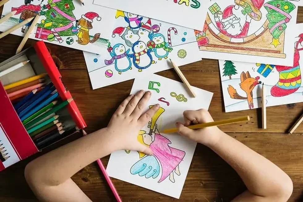Child making one of the nine types of family Christmas card. 