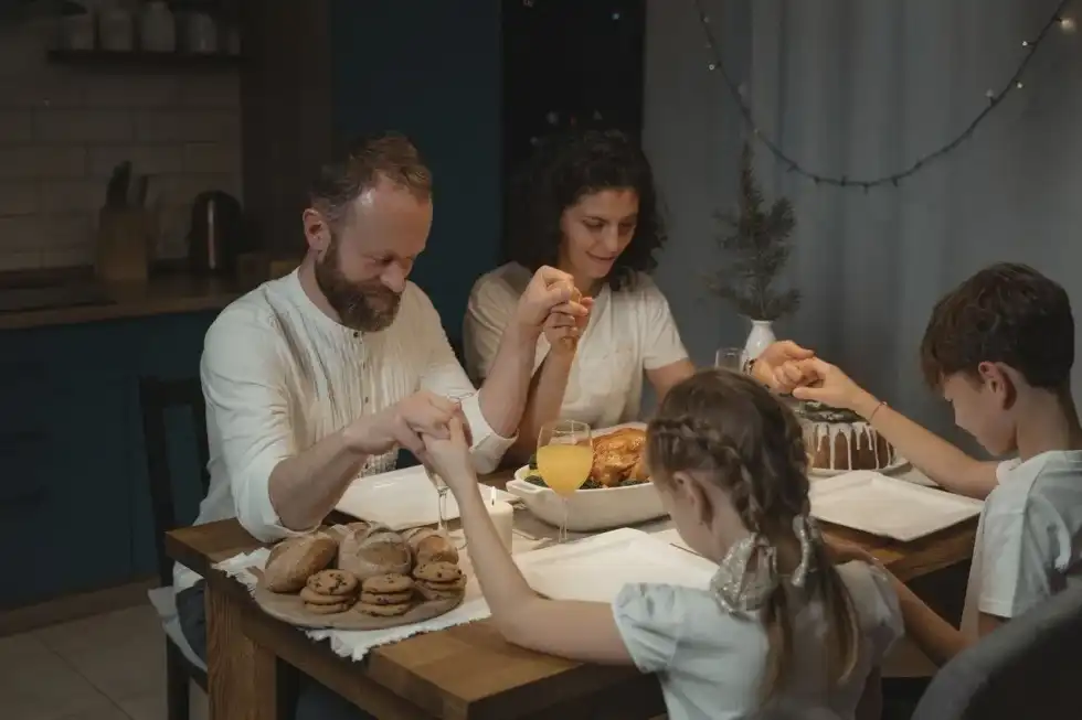Christians pray before eating their meals; read on for facts about prayer.