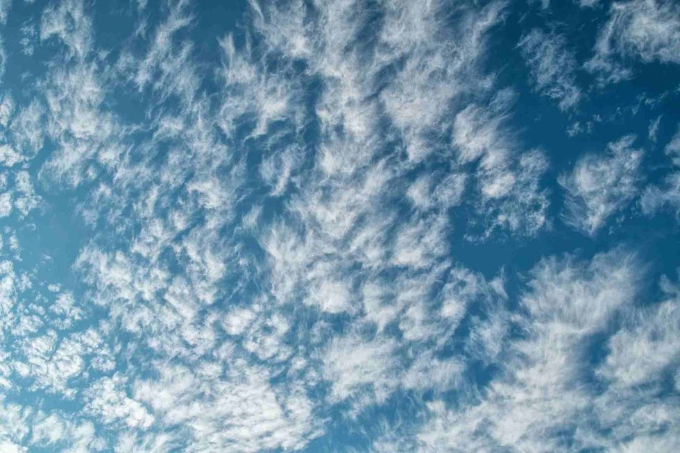 Cirrus clouds form beautiful patterns during sunset.