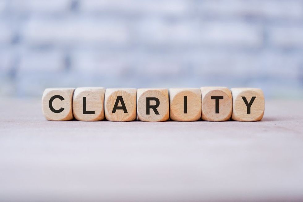 Clarity word written on wood block