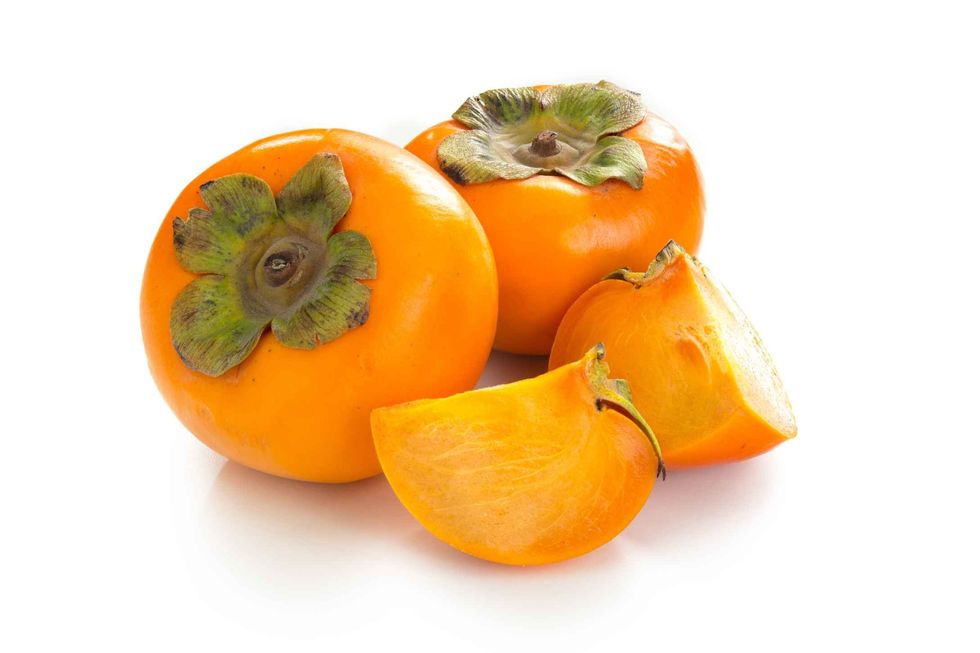 Close up fresh orange organic ripe Fuyu Persimmons