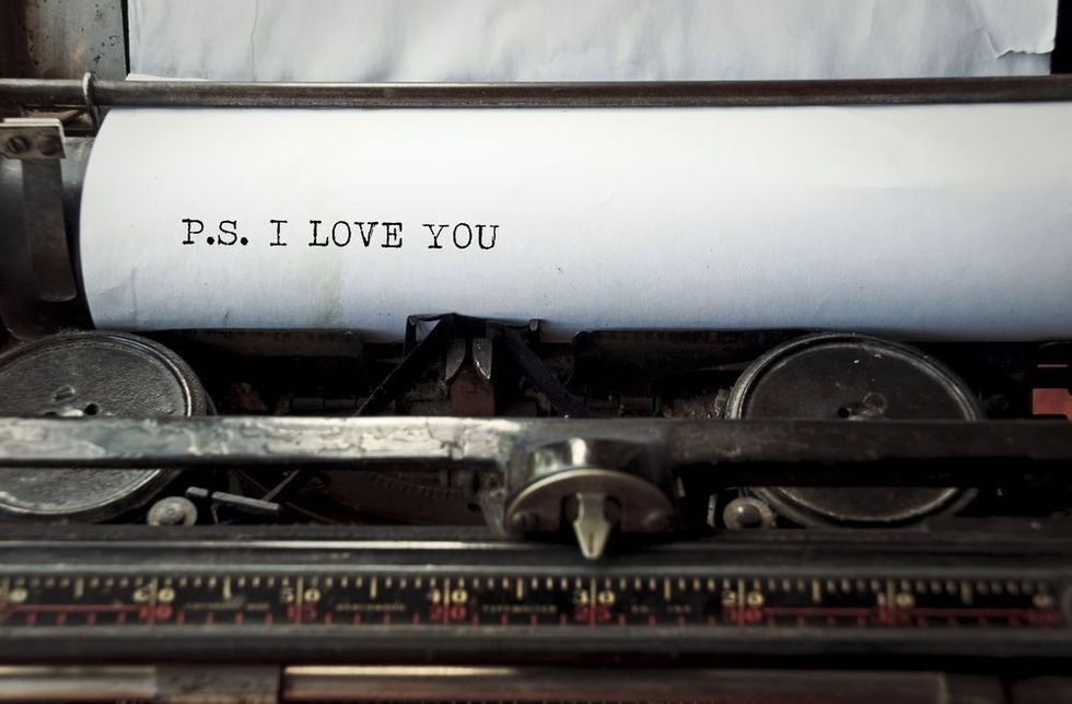 Close up image of typewriter with paper sheet