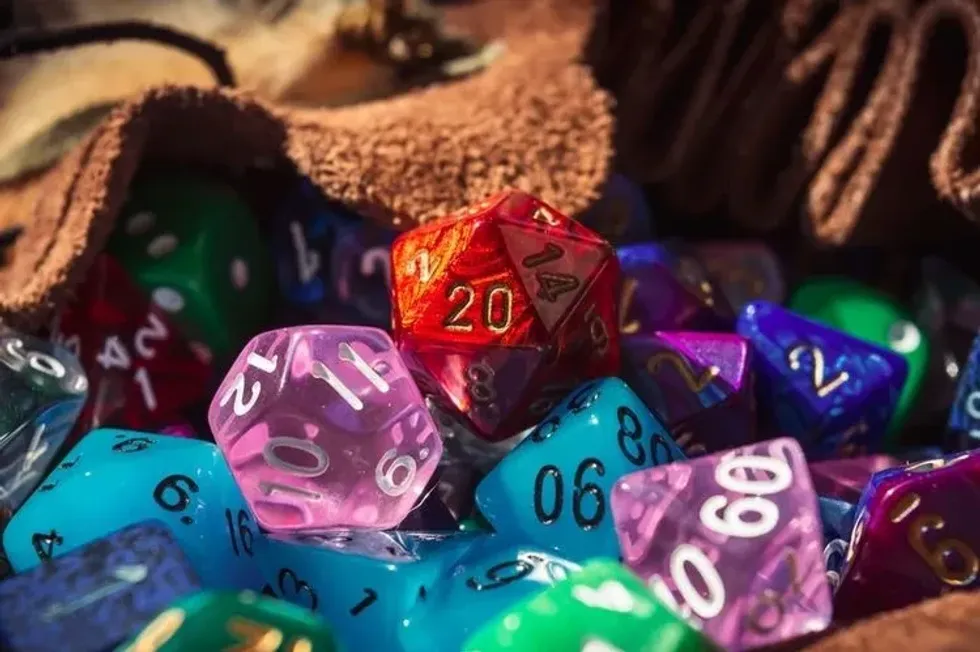 Close up of colorful d20 die scattered