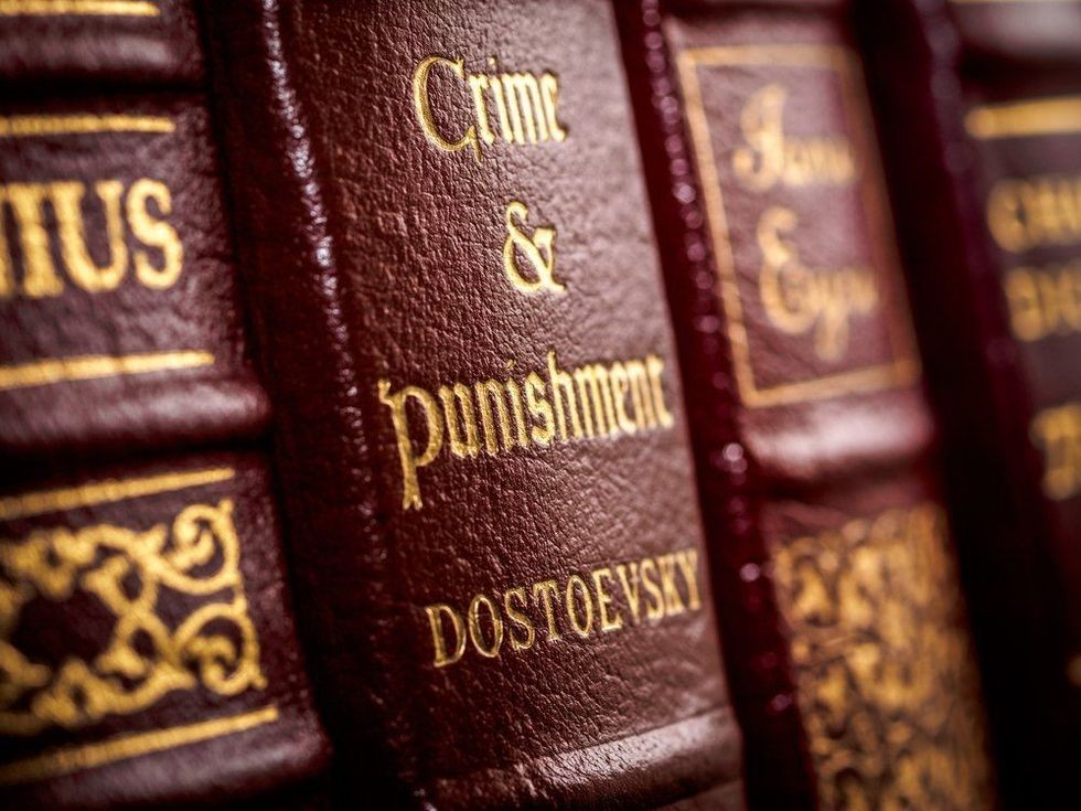 Close up of leather bound Crime and Punishment book spine showing author's name of Russian writer Fyodor Dostoevsky.