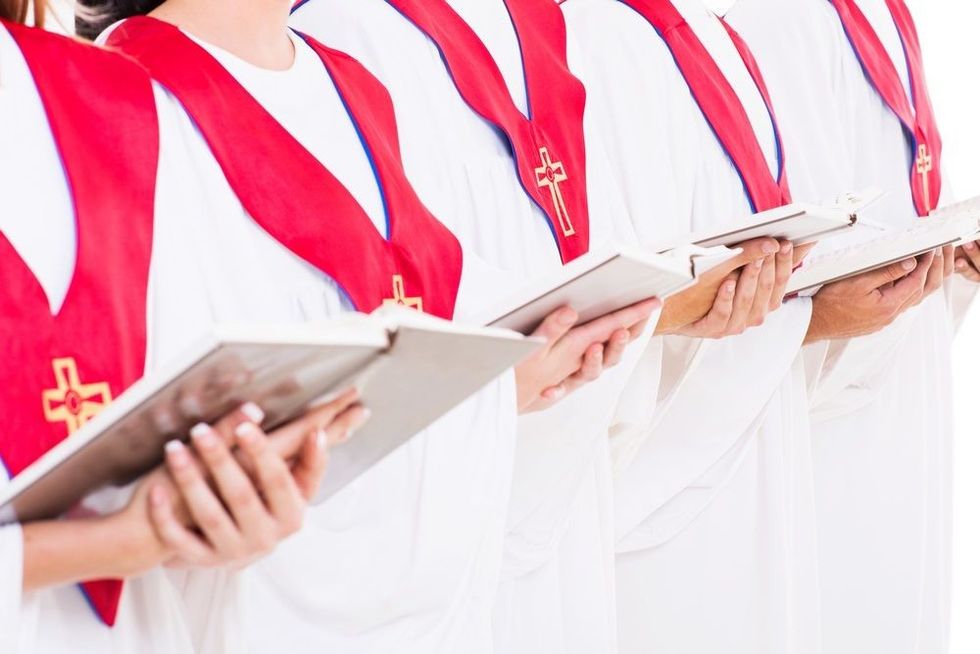 Close up portrait of church choir holding hymn books.