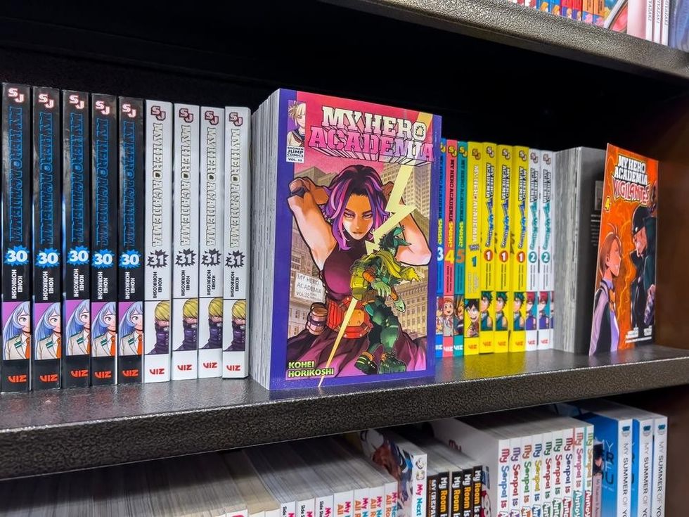 Close up selective focus on My Hero Academia manga for sale inside a Barnes and Noble store.