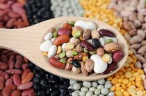 Closeup mix bean spoon on mix bean background.