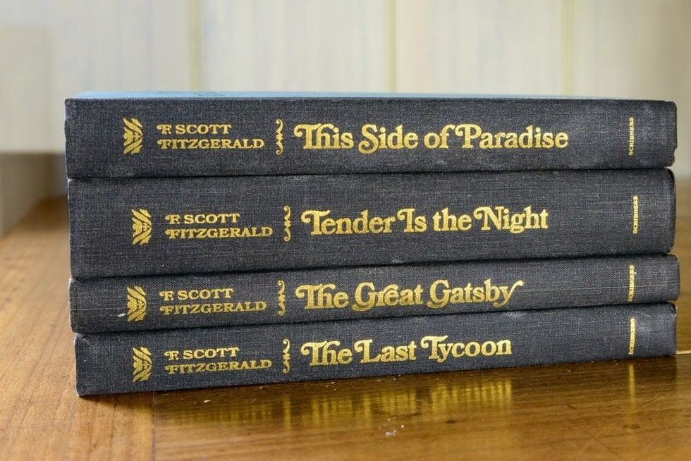  Closeup of four F. Scott Fitzgerald books stacked sideways