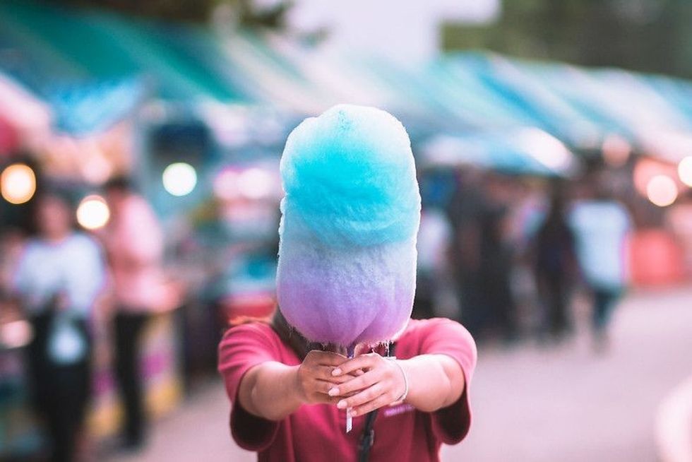 Colorful cotton candy in the hand.