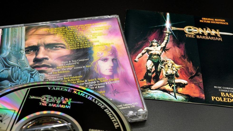 Cover and artwork of the Arnold Schwarzenegger film, Conan the barbarian.