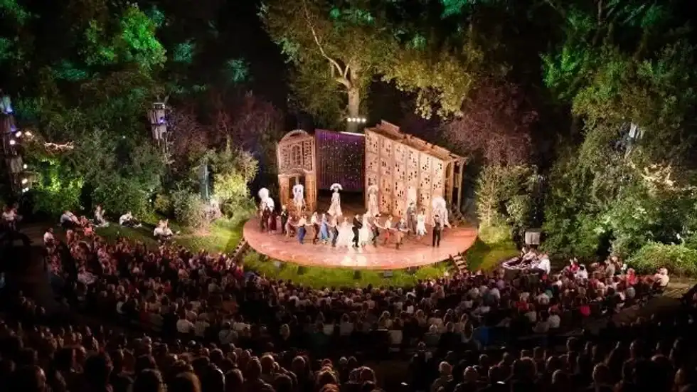 Crowd in front of the stage at Regent's Park Open Air Theatre.