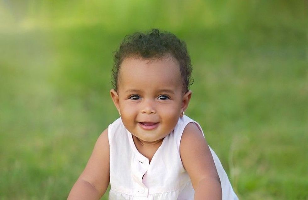 Cute baby girl in park.
