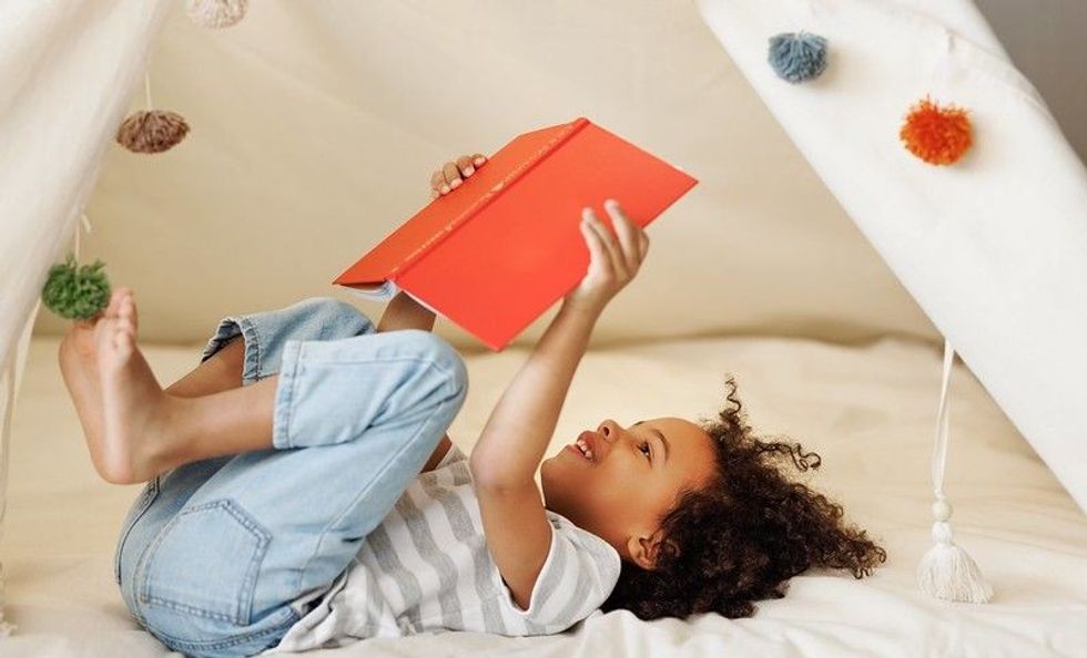 Cute girl reading a book