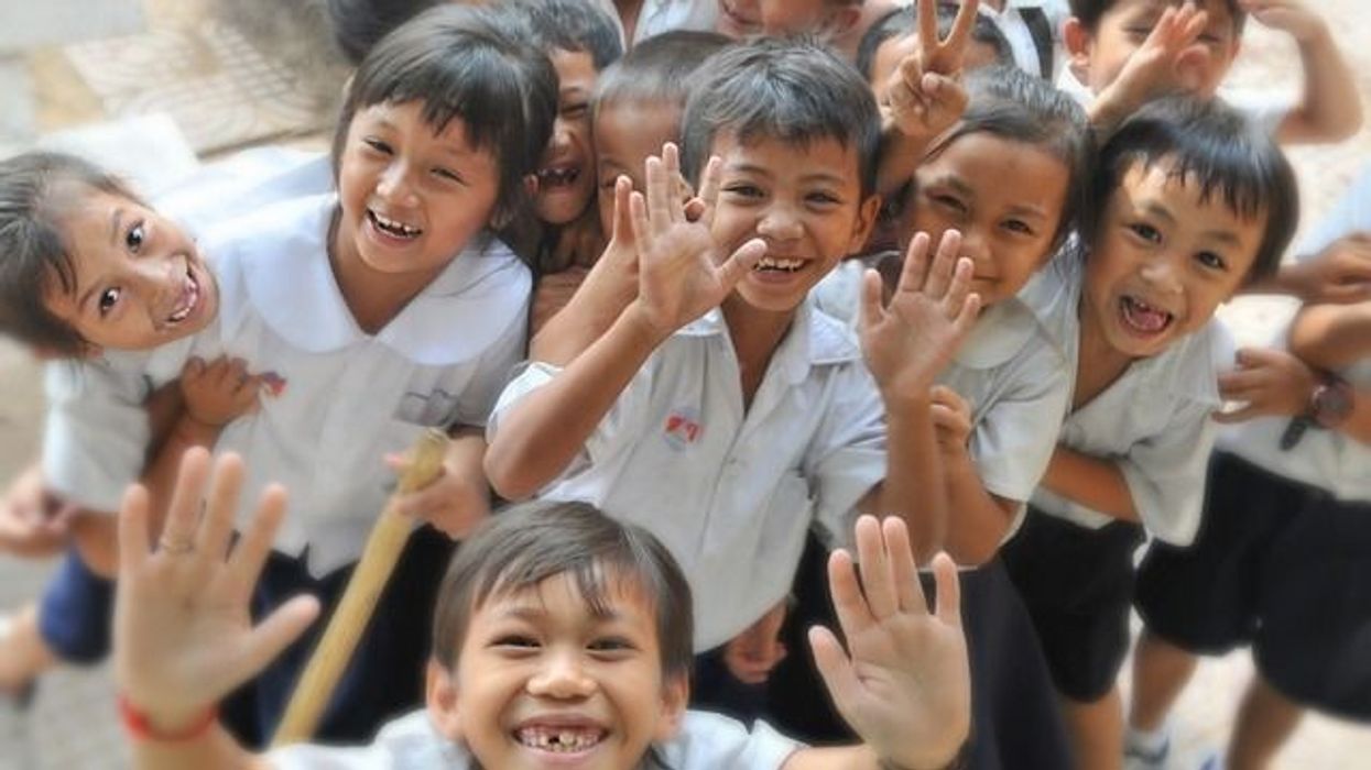 Cute school kids smiling at camera
