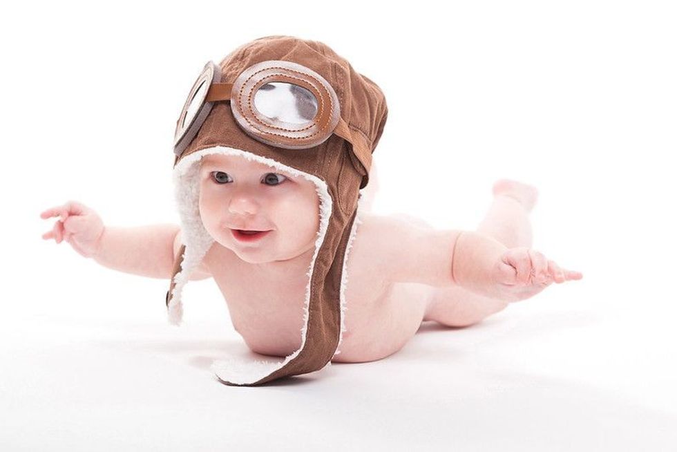 cute smiling baby in the cap of the pilot - Nicknames