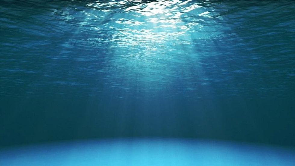 Dark blue ocean surface seen from underwater