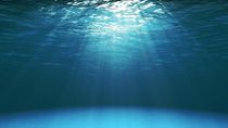 Dark blue ocean surface seen from underwater