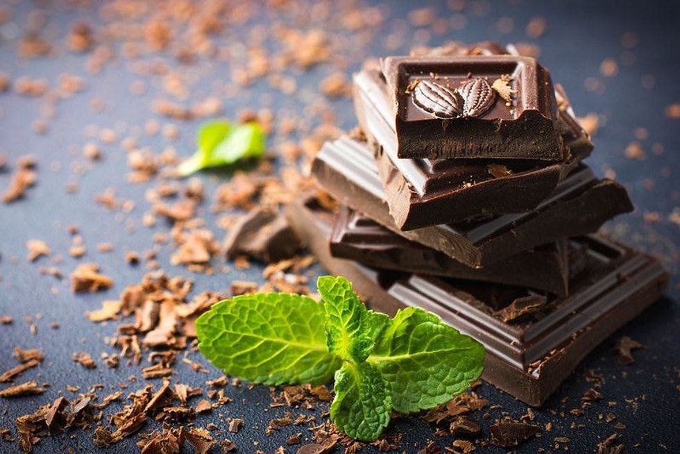 Dark chocolate with mint leaves.