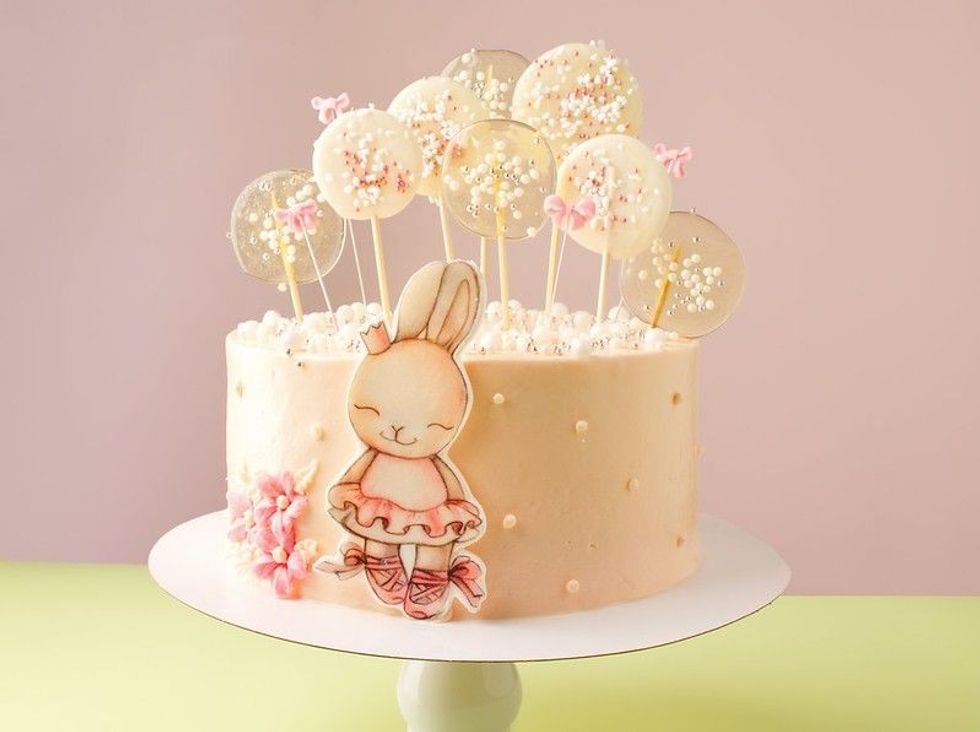 Delicate pink baby cake with a bunny for a girl.