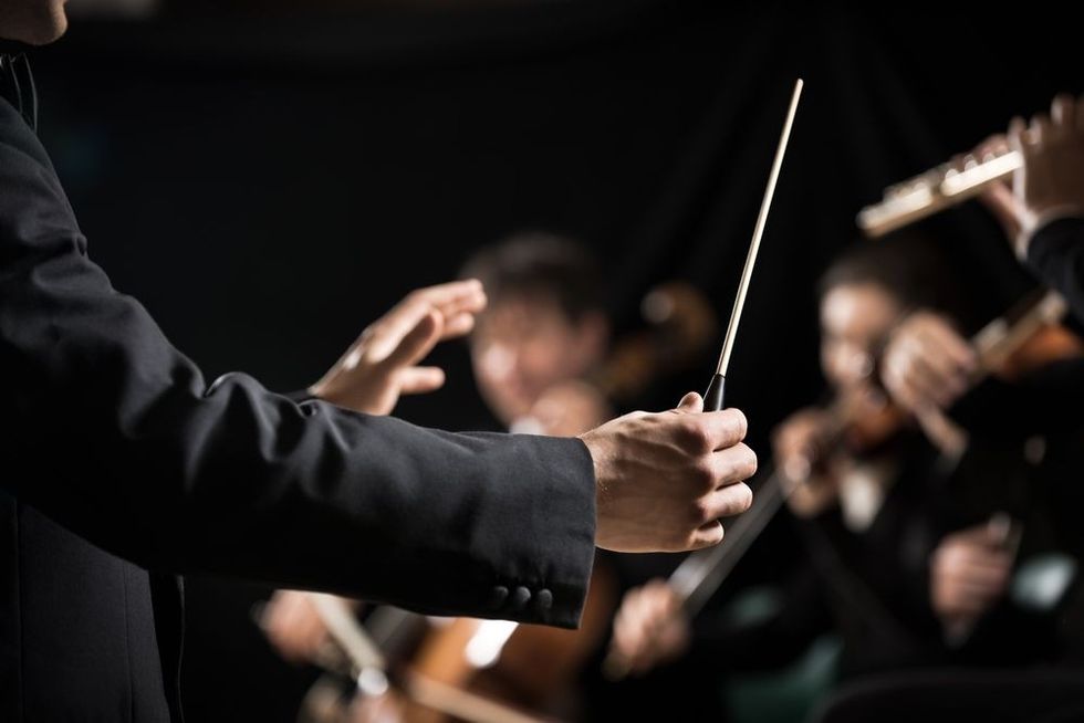 Directing symphony orchestra with performers