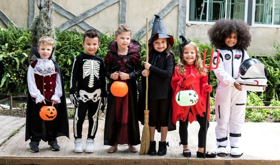 Diverse kids in Halloween costumes